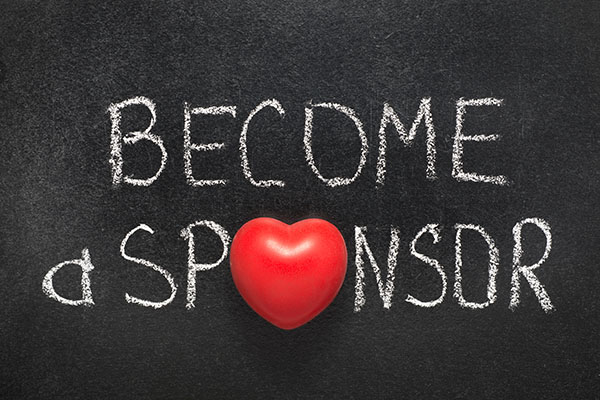 become a sponsor phrase handwritten on chalkboard with heart symbol instead of O